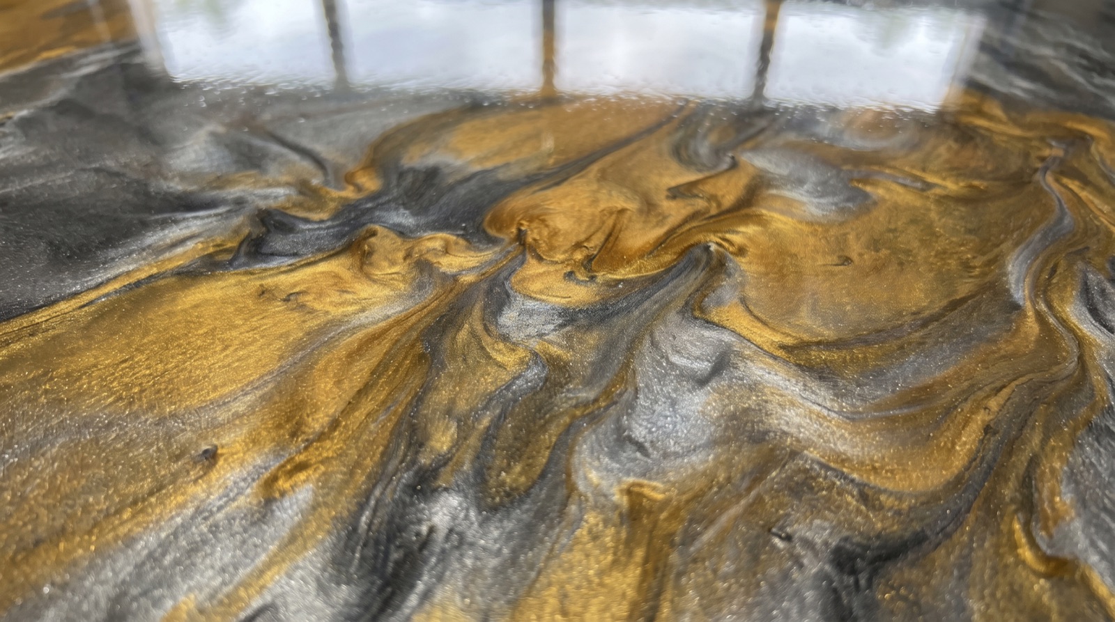 Close-up of a decorative polyaspartic garage floor coating finish